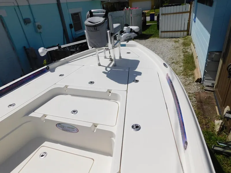 Slide: The Image of 2016 Skeeter 240SX boat deck with storage compartments and seating. - 20
