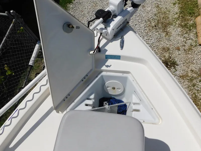 Slide: The Image of Open storage compartment on 2016 Skeeter 240SX boat deck. - 23