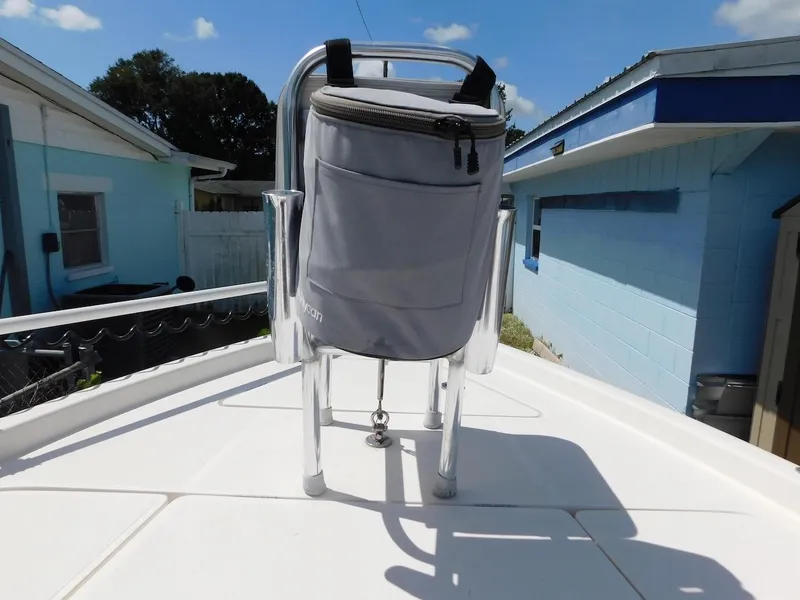 Slide: The Image of 2016 Skeeter 240SX boat deck with mounted cooler under sunny sky. - 24