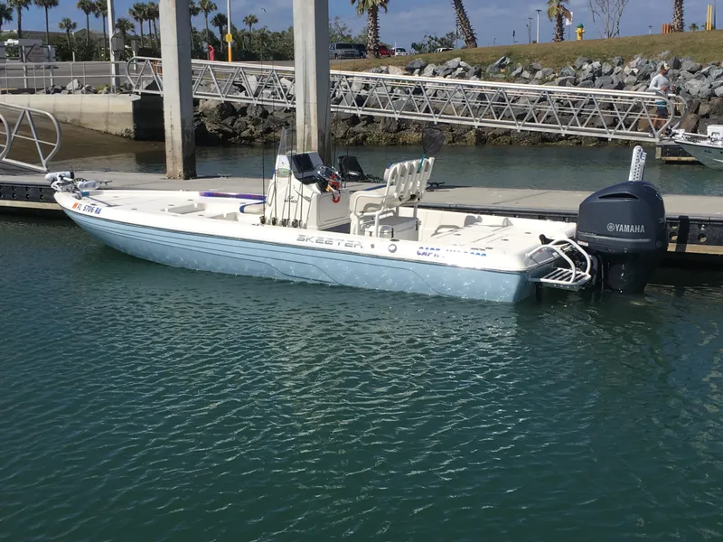Slide: The Image of Skeeter 240SX 2016 boat docked at marina with Yamaha outboard motor. - 27