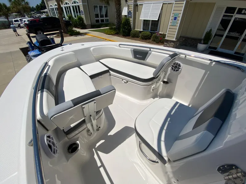 Slide: The Image of 2026 Robalo R200 Center Console boat interior with white seating and modern design. - 14