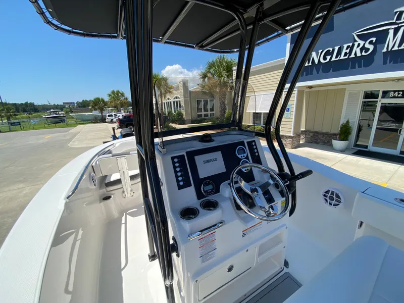 Slide: The Image of 2026 Robalo R200 Center Console boat interior with steering wheel and controls. - 9