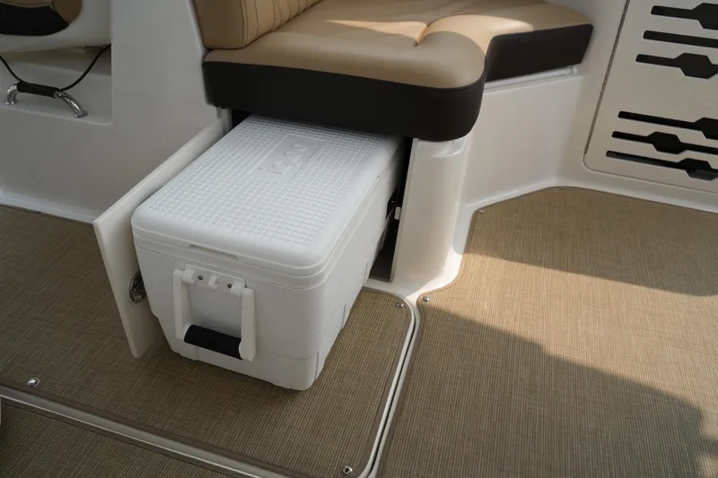 Slide: The Image of 2023 Sea Ray SLX 310 interior with built-in cooler under seat. - 22