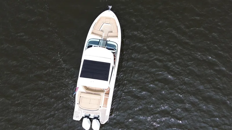 Slide: The Image of Aerial view of 2023 Sea Ray SLX 310 boat on water. - 6
