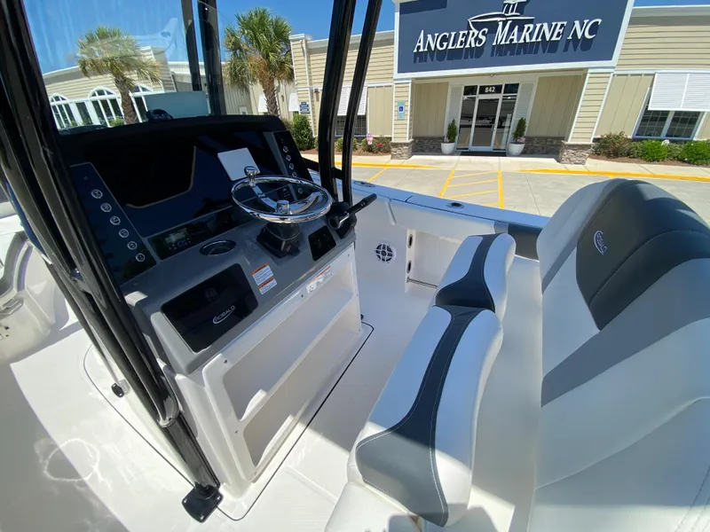 Slide: The Image of 2026 Robalo R230 Center Console boat interior at Anglers Marine NC dealership. - 14