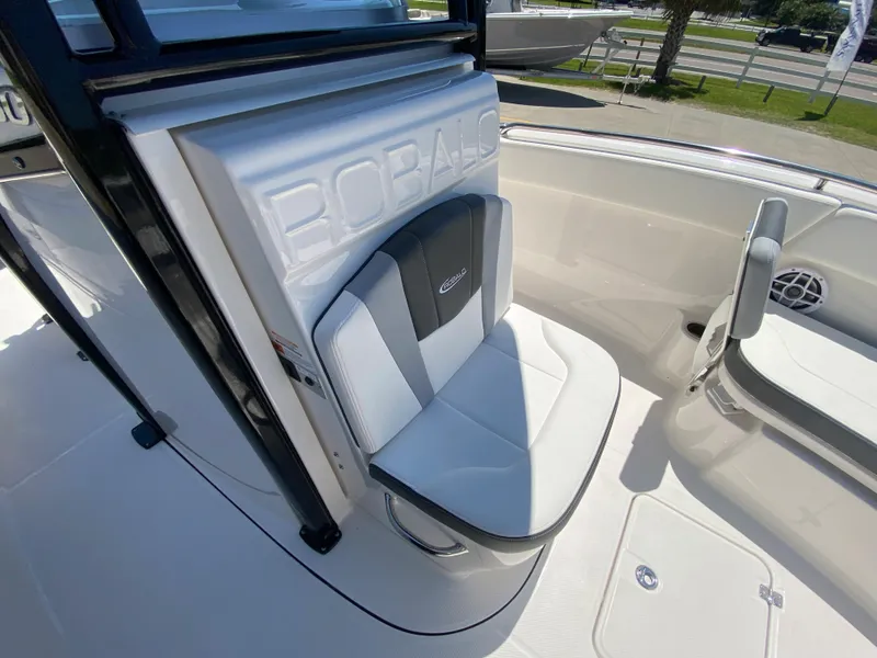 Slide: The Image of 2026 Robalo R230 Center Console boat interior with cushioned seating. - 20