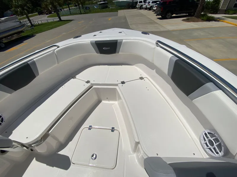 Slide: The Image of 2026 Robalo R230 Center Console boat interior with spacious seating and storage compartments. - 26