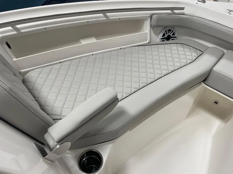 Slide: The Image of 2024 Pursuit DC 246 Dual Console boat interior with cushioned seating. - 21