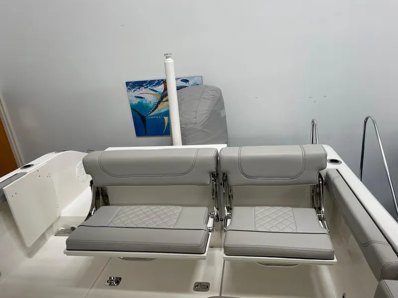 Slide: The Image of 2024 Pursuit DC 246 Dual Console boat with gray seating. - 6