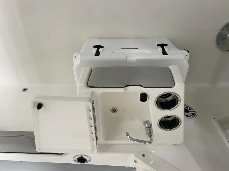 Slide: The Image of 2024 Pursuit DC 246 Dual Console boat sink and prep station. - 8