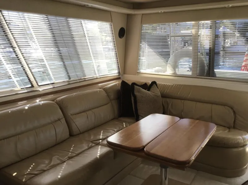 Slide: The Image of Luxurious interior of 2004 Meridian 490 Pilothouse with leather seating and wooden table. - 3