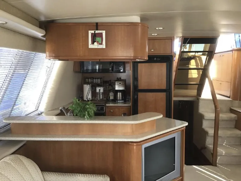 Slide: The Image of Interior of 2004 Meridian 490 Pilothouse yacht with kitchen and stairs. - 4