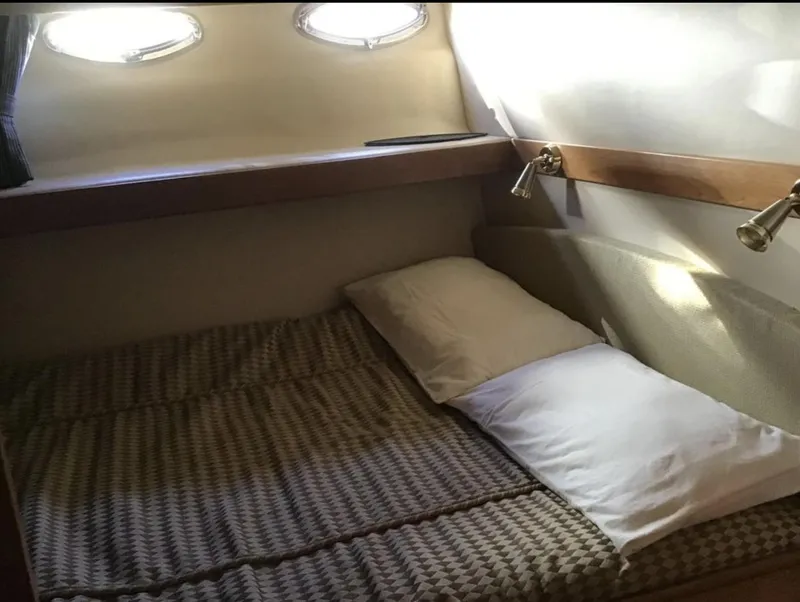 Slide: The Image of Cozy cabin interior of 2004 Meridian 490 Pilothouse with bed and porthole windows. - 7