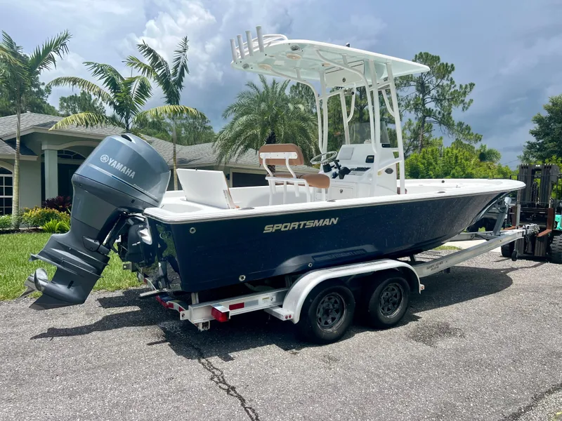 Slide: The Image of 2013 Sportsman 227 Masters boat on a trailer with Yamaha outboard motor. - 10