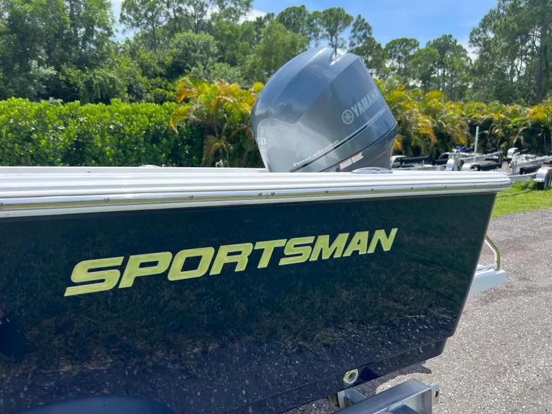 Slide: The Image of 2013 Sportsman 227 Masters boat with Yamaha engine in a lush outdoor setting. - 12