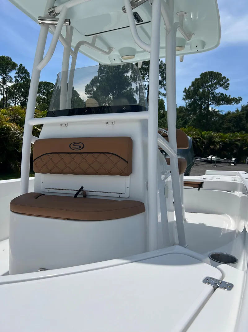 Slide: The Image of 2013 Sportsman 227 MASTERS boat with tan seating and white console. - 15
