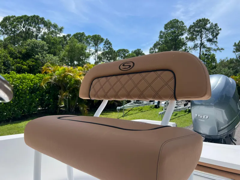 Slide: The Image of 2013 Sportsman 227 MASTERS boat seat with engine in background. - 16