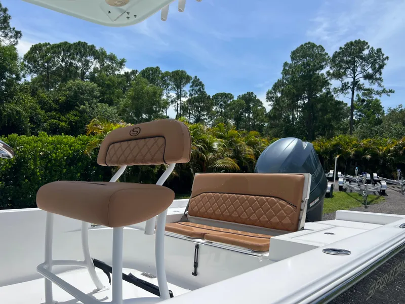 Slide: The Image of 2013 Sportsman 227 Masters boat with tan seating, outdoor setting. - 17