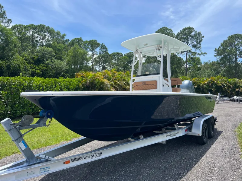 Slide: The Image of 2013 Sportsman 227 MASTERS boat on AmeraTrail trailer in outdoor setting. - 2