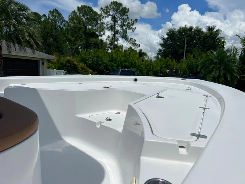 Slide: The Image of 2013 Sportsman 227 MASTERS boat deck with storage compartments and seating. - 20