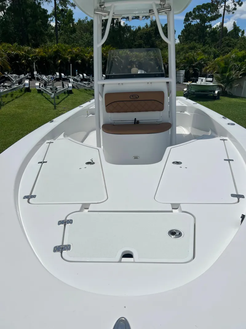 Slide: The Image of 2013 Sportsman 227 MASTERS boat with open deck and seating. - 21