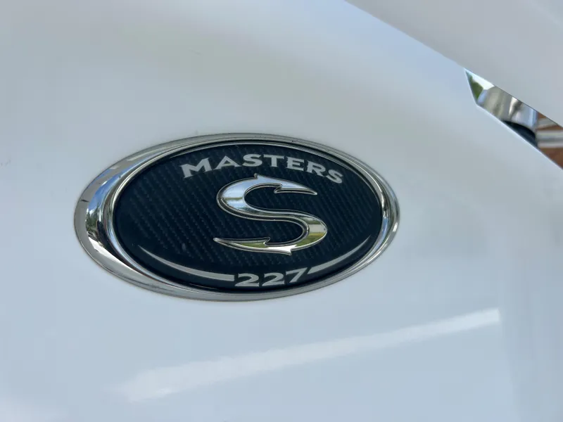 Slide: The Image of 2013 Sportsman 227 Masters boat emblem. - 23