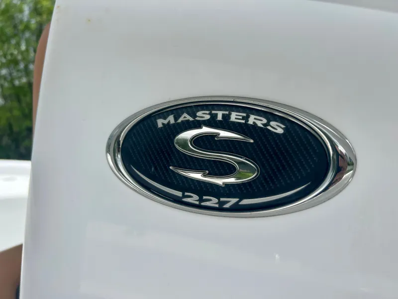 Slide: The Image of 2013 Sportsman 227 Masters boat emblem. - 24