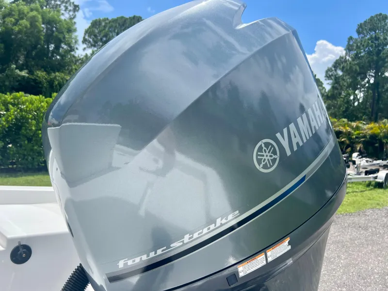 Slide: The Image of Yamaha four-stroke outboard motor on a 2013 Sportsman 227 Masters boat. - 28