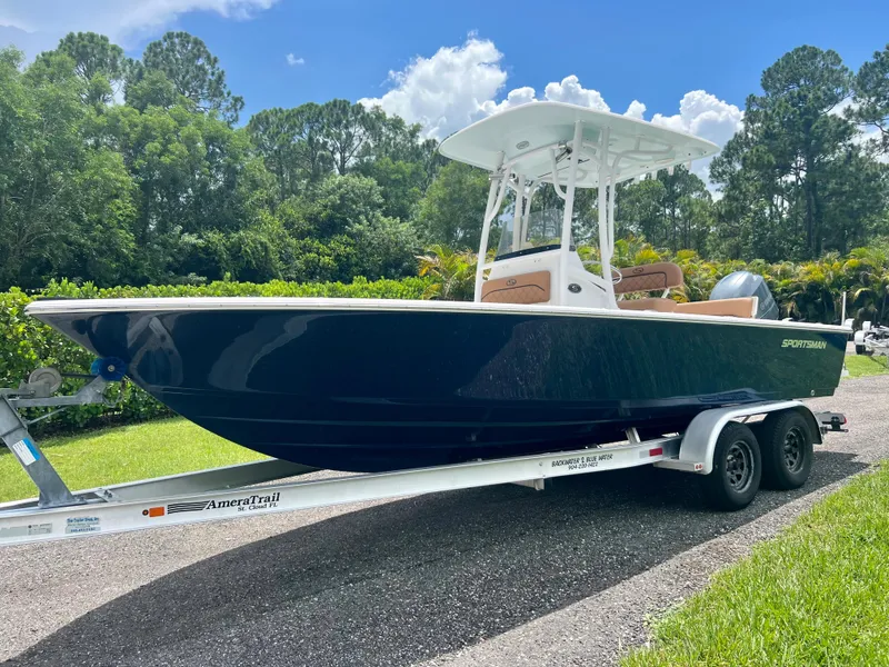 Slide: The Image of 2013 Sportsman 227 MASTERS boat on trailer in a scenic outdoor setting. - 3