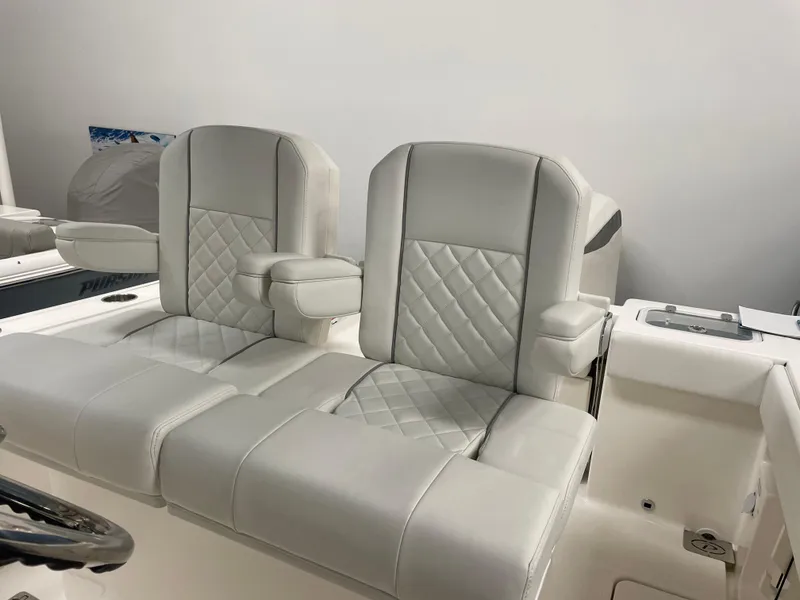 Slide: The Image of 2024 Pursuit S 248 Sport boat with luxurious white leather seats. - 5