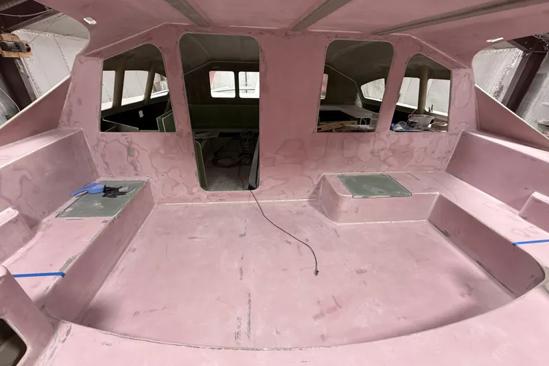 Slide: The Image of Interior view of 2026 Schionning Arrow 1280 S catamaran under construction. - 109