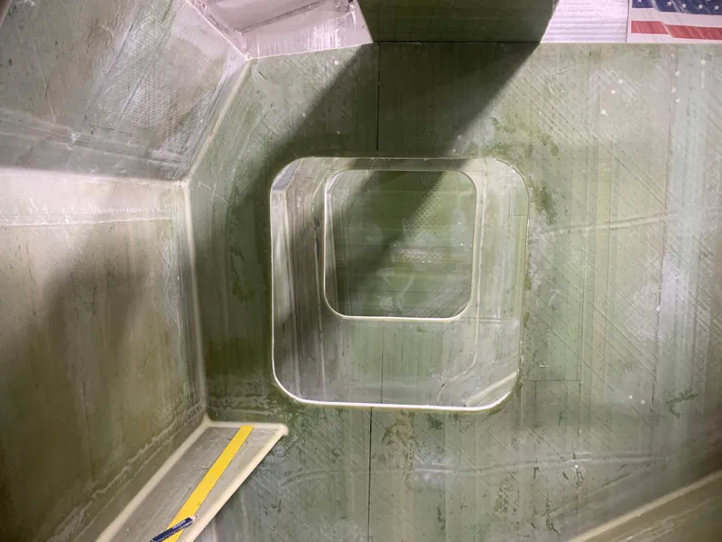 Slide: The Image of Interior view of 2024 Schionning Arrow 1280 S catamaran under construction. - 22