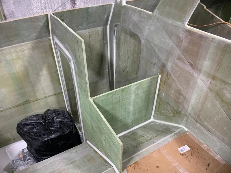 Slide: The Image of Interior construction of 2024 Schionning Arrow 1280 S catamaran in progress. - 23