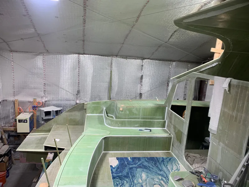 Slide: The Image of 2024 Schionning Arrow 1280 S under construction in a workshop. - 34