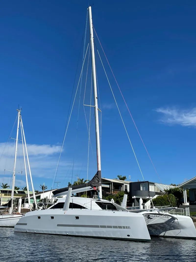 Slide: The Image of 2024 Schionning Arrow 1280 S catamaran sailing on the ocean. - 4