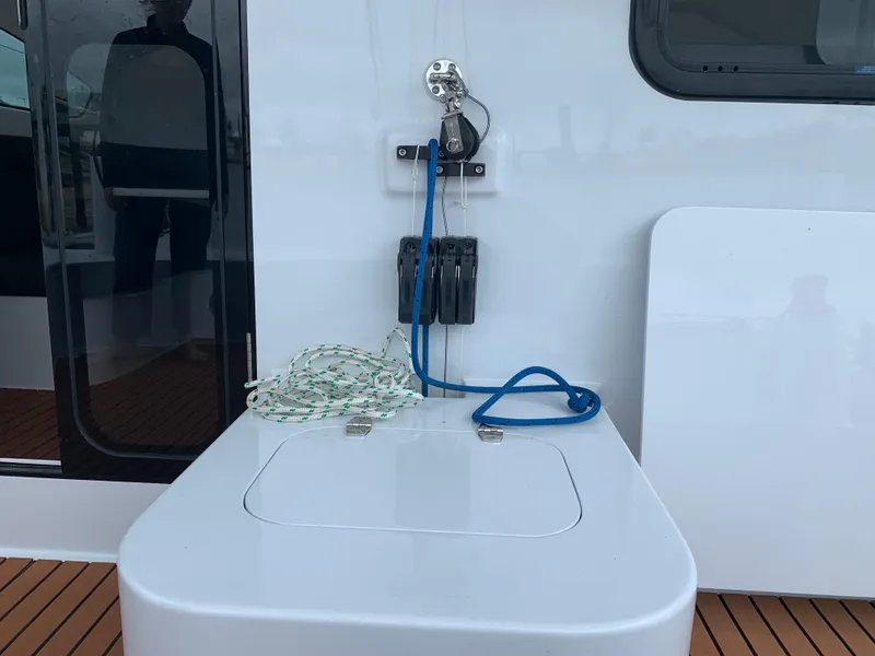 Slide: The Image of 2024 Schionning Arrow 1280 S yacht deck with ropes and winch. - 45