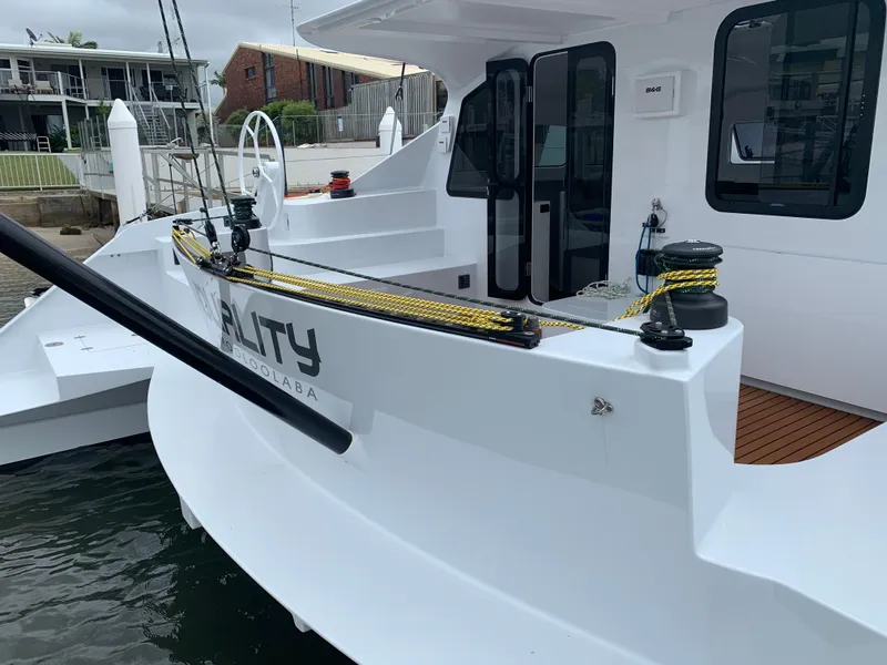 Slide: The Image of 2024 Schionning Arrow 1280 S catamaran docked at marina. - 46