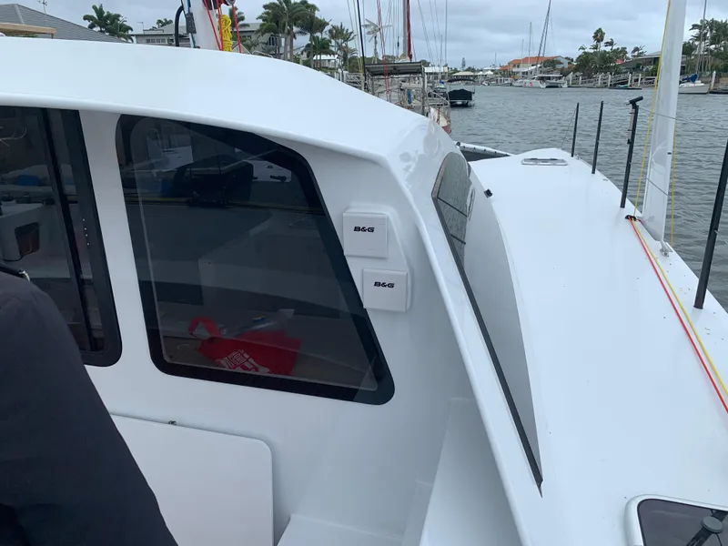 Slide: The Image of 2024 Schionning Arrow 1280 S catamaran docked at marina. - 48