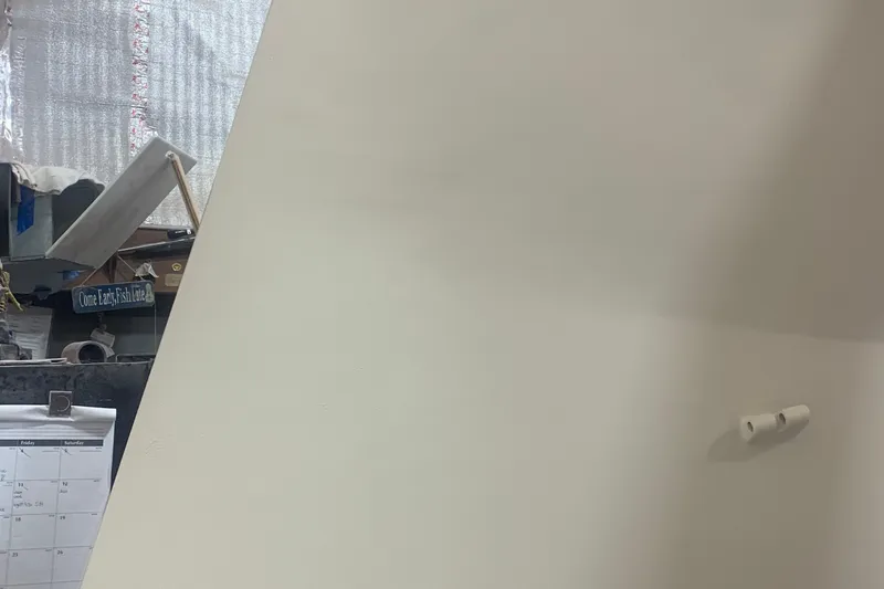 Slide: The Image of Interior view of a 2026 Schionning Arrow 1280 S boat under construction. - 99