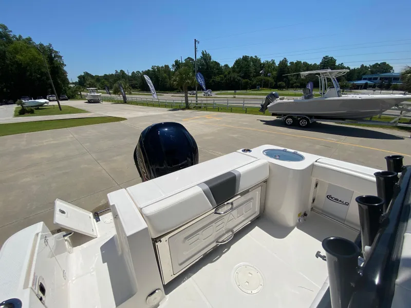 Slide: The Image of 2024 Robalo R230 Center Console boat, rear view with outboard motor. - 8