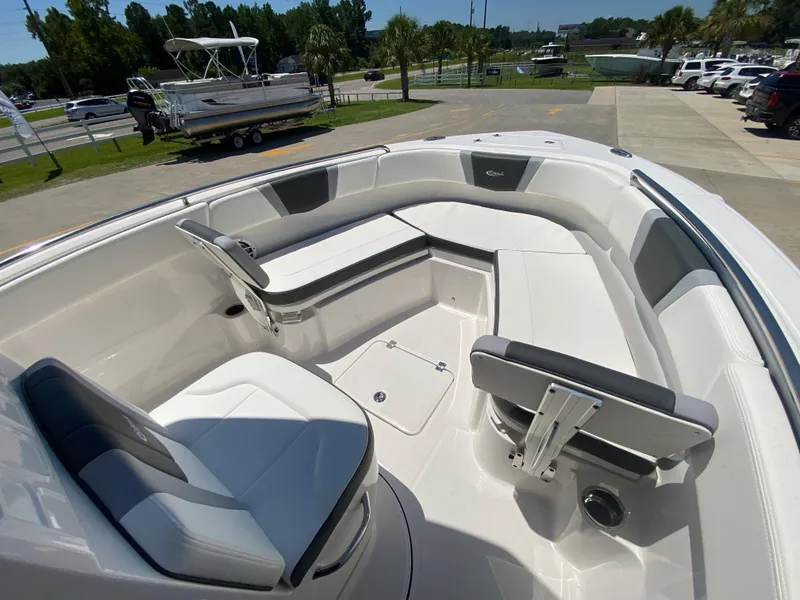 Slide: The Image of 2024 Robalo R230 Center Console boat interior with seating and storage. - 19