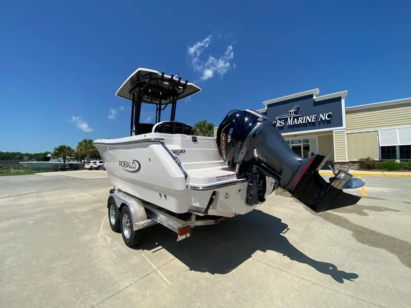 Slide: The Image of 2024 Robalo R230 Center Console boat on trailer at dealership. - 4