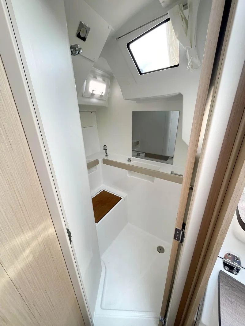 Slide: The Image of 2024 Beneteau Oceanis 38.1 yacht bathroom with modern fixtures and natural light. - 7