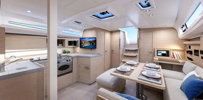 Slide: The Image of Interior of 2026 Beneteau Oceanis 40.1 yacht, featuring modern kitchen and dining area. - 11