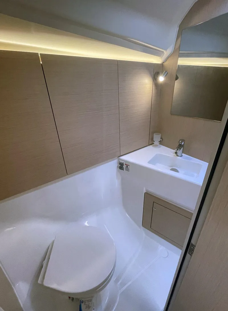 Slide: The Image of Modern bathroom in 2026 Beneteau Oceanis 40.1 yacht, featuring sleek design and compact amenities. - 14