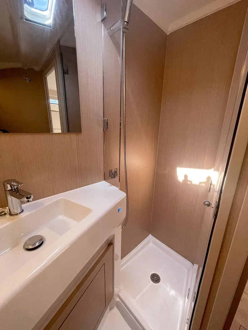 Slide: The Image of 2026 Beneteau Oceanis 40.1 yacht bathroom with modern sink and shower. - 15
