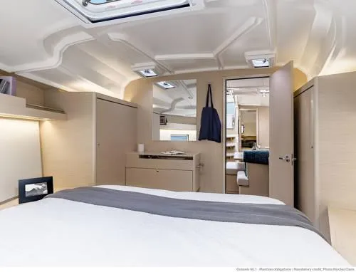 Slide: The Image of Interior of 2026 Beneteau Oceanis 40.1 yacht, featuring a modern bedroom with elegant design. - 16