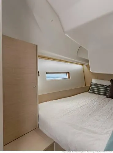 Slide: The Image of 2026 Beneteau Oceanis 40.1 cabin interior with bed and window view. - 19