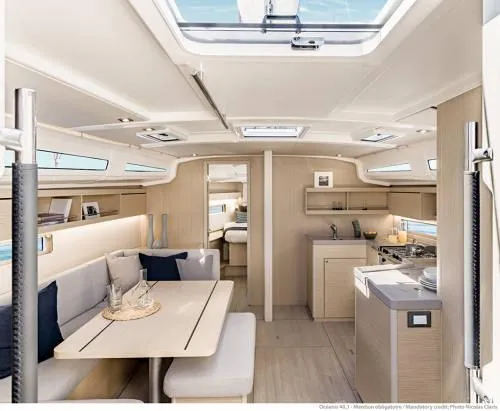 Slide: The Image of Luxurious interior of 2026 Beneteau Oceanis 40.1 yacht with modern kitchen and dining area. - 26