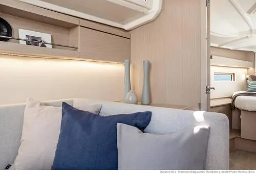 Slide: The Image of Interior of 2026 Beneteau Oceanis 40.1 yacht with modern decor and cozy seating. - 29